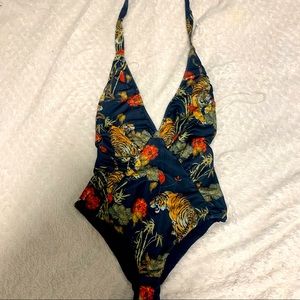 Brand new body suit. Honey. Can be used as swimsuit. Small